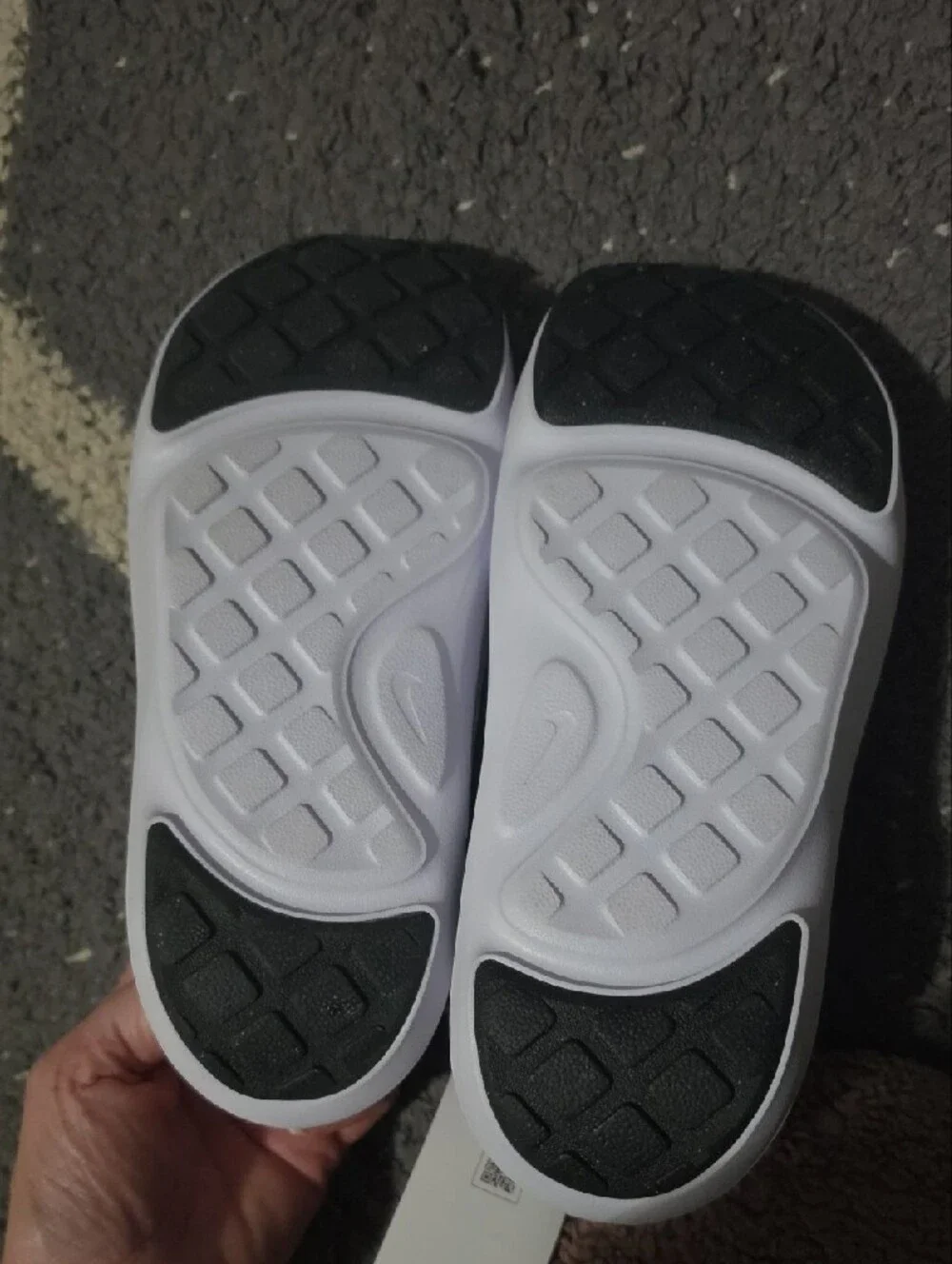 Nike Kids Black and White Slip-On Sandals with Perforated Upper